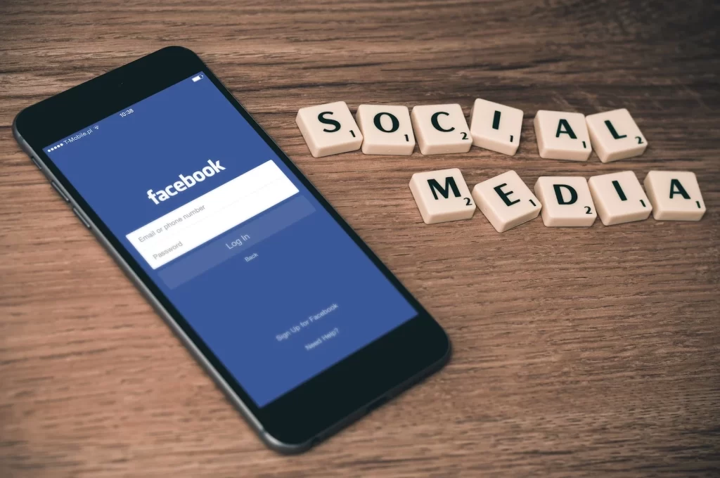 Smartphone with the Facebook app and social media tiles