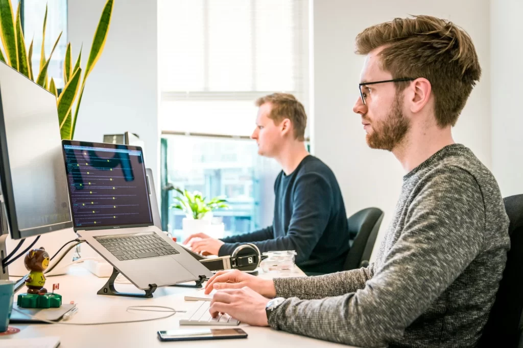 Team planning a website on a laptop